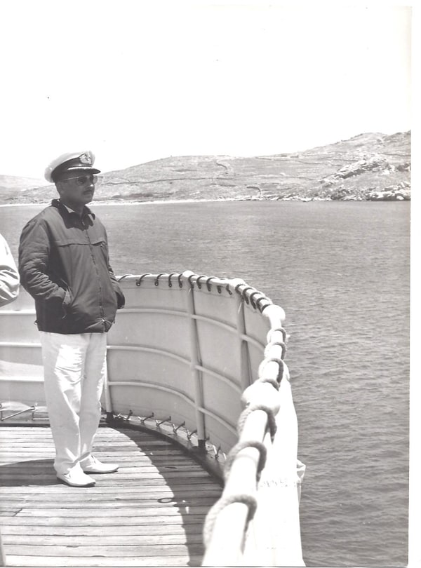 Captain Michael Vogiatzoglou in uniform, on the deck of his ship